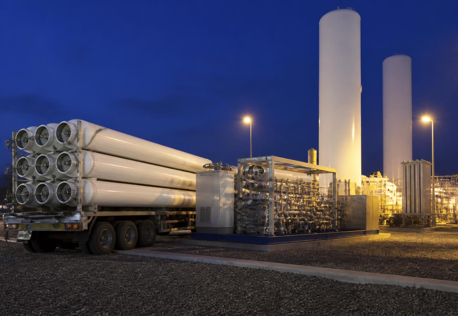 CNG tube trailer, compression skid and cryogenic storage tanks at a gas facility